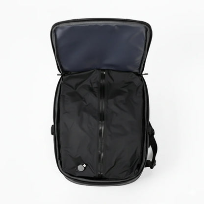 Black backpack with open lid on a white background